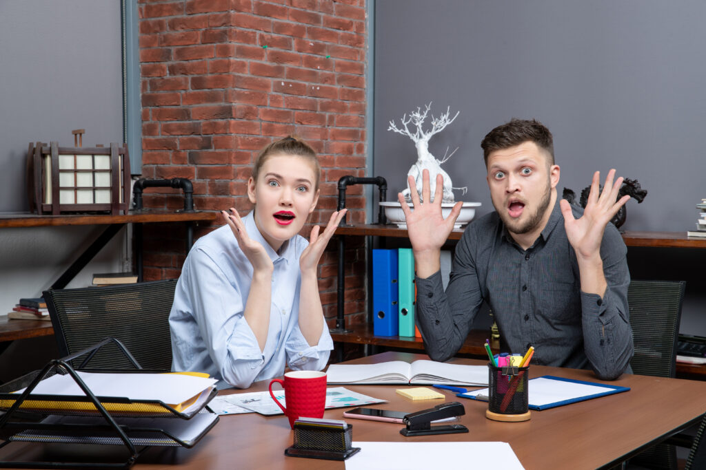 top view shocked office team sitting table posing camera office - Executive-Women The Promotion Stealer: Why Some People Take Credit for Work They Never Did - By Pamela Sakha